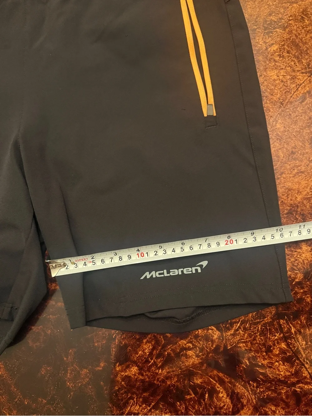Castore x McLaren Men's Black Athletic Shorts with Yellow Zip Accents